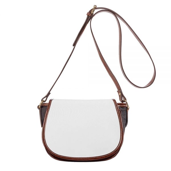 A white crossbody saddle bag's rope is suspended in mid-air.