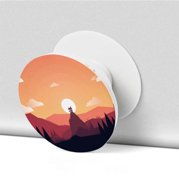 a white phone holder with a sunset image printed on the back