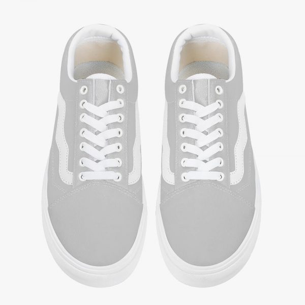 A pair of grey low-top canvas sneakers