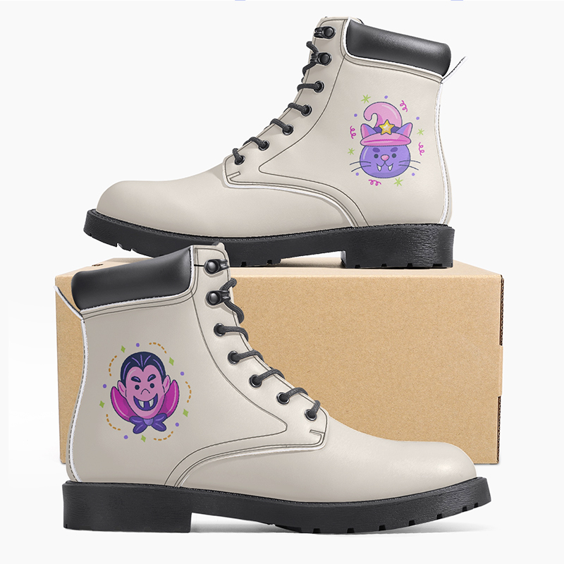 Boots with cartoon designs A pair of beige boots with cartoon characters