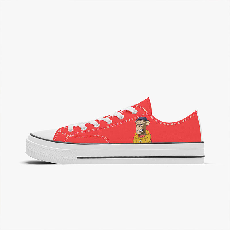 Cartoon style shoes A pair of orange low-top sneakers with a cartoon monkey