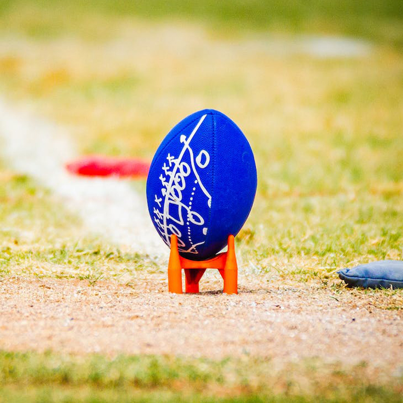Create your football from the ground up A blue football is placed on the playing field
