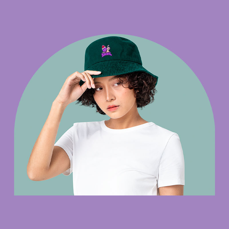 How to create your hats A woman in a white T-shirt with a green hat