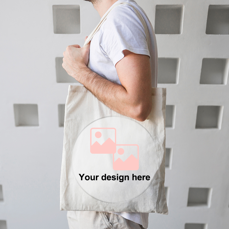 Sell POD tote bags with JetPrint A male model is carrying a canvas tote bag