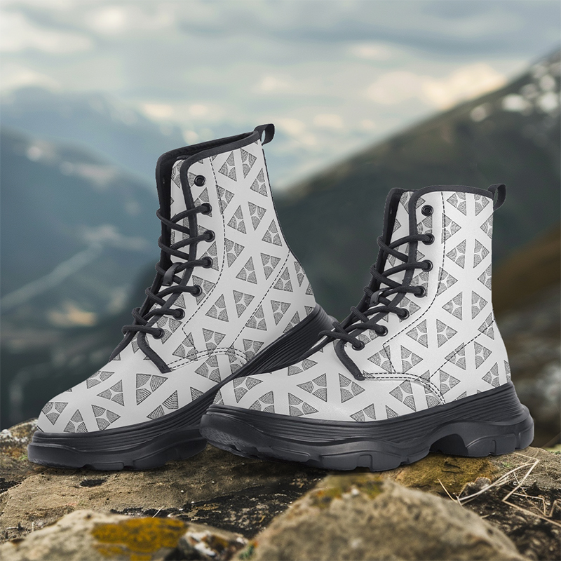 Why choose JetPrint for your custom boots A pair of white boots with patterns are placed on the ground